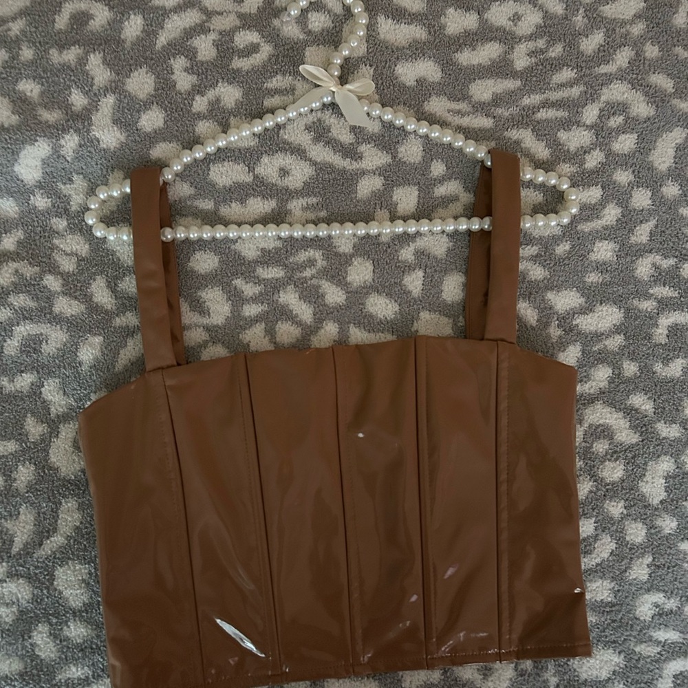 SOLD

Worn once leather cropped top